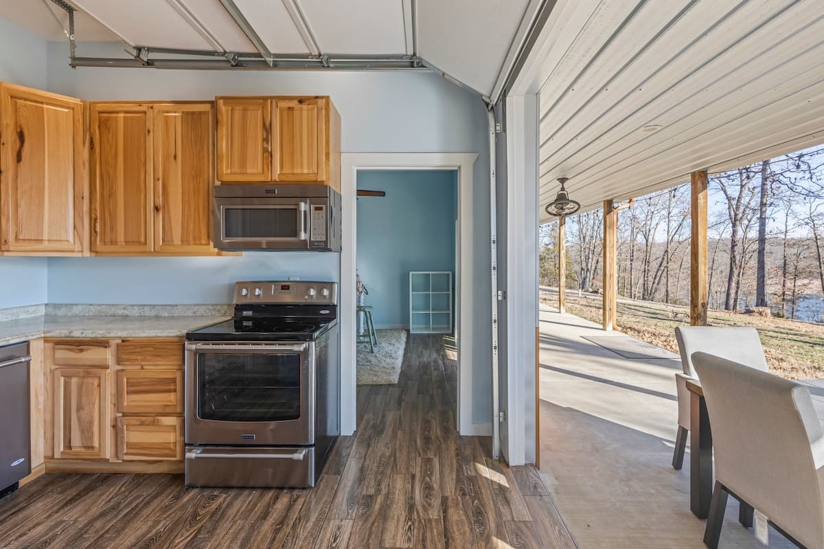 Kitchen with garage-style door to patio